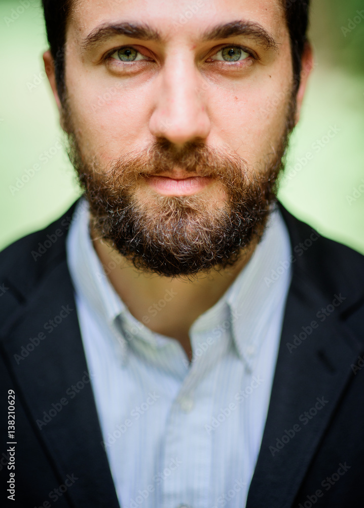 Bearded man with short hair and deep green eyes Bearded man with short hair and deep green eyes