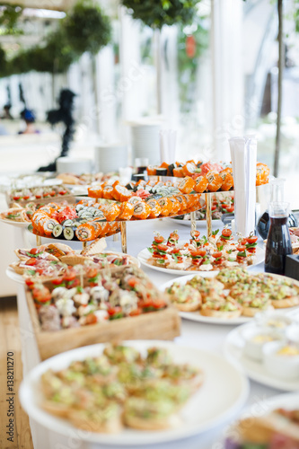 sushi and snacks on buffet table