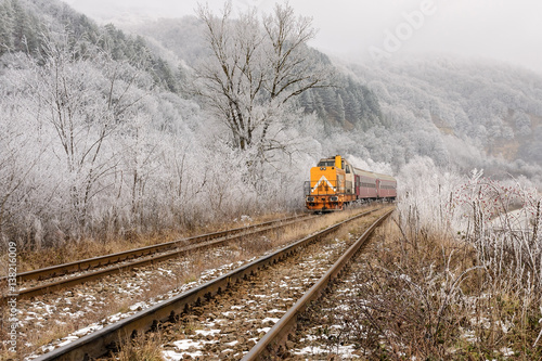 Yellow Locomotive in Winter Landscape