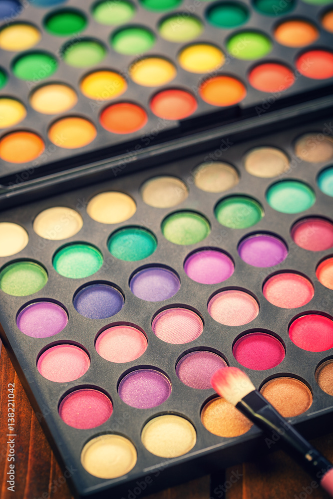 Multi colored make-up and brush Multi colored make-up and brush