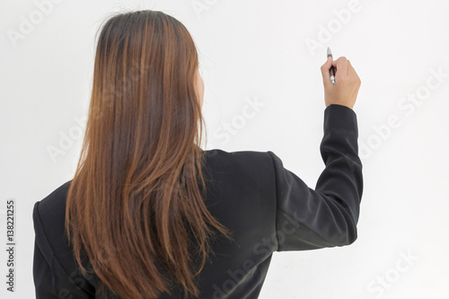 Business woman working in the office. Use a pen to write the board explained