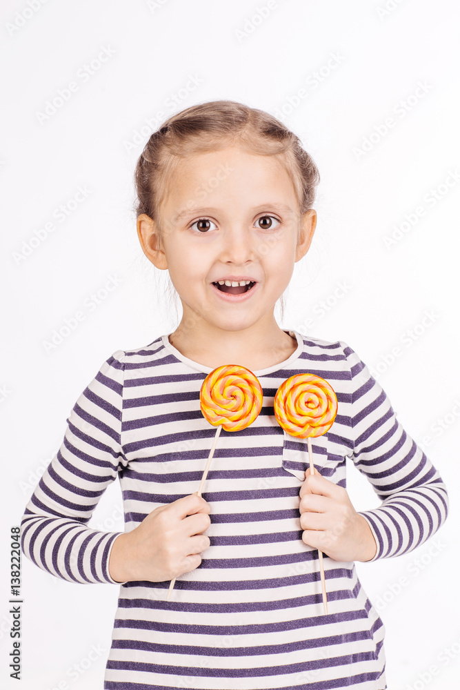 Happy girl with lollipop.