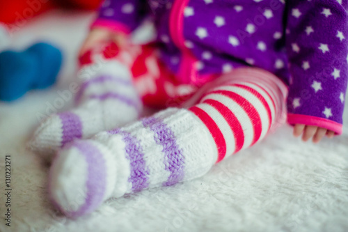 Beautiful cute baby in the socks close-up