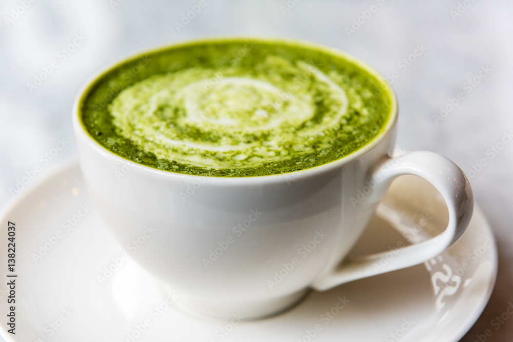 Hot green tea matcha latte in a cup Hot green tea matcha latte in a cup