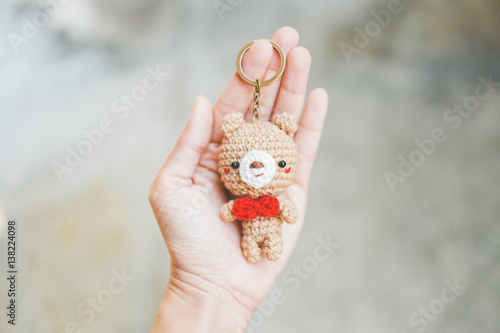 The bear doll in hand