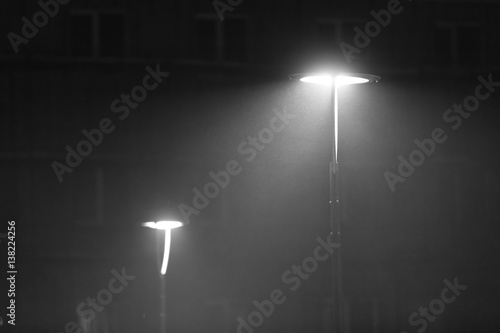 two lanterns in a misty winter evening - black and white