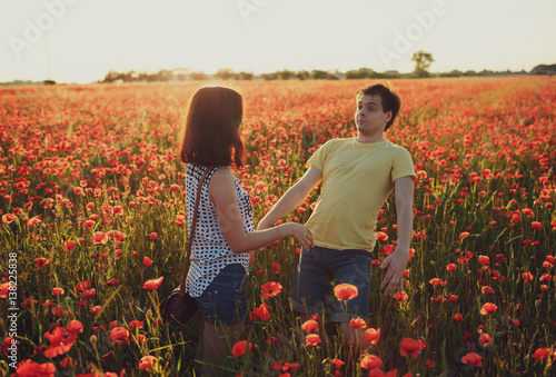 funny young man posing in front of his woman © myronovychoksana