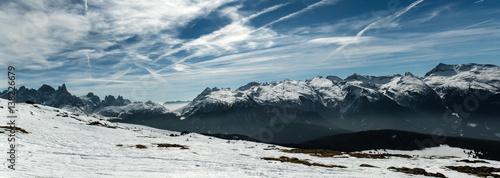 Beautiful panorama od winter italian Alp mountains with dramatic sky and clouds © Michal