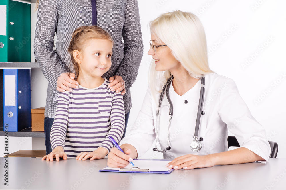 doctor examining a child girl in a hospital doctor examining a child girl in a hospital