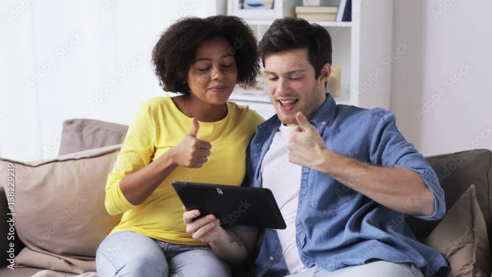 smiling happy couple with tablet pc at home smiling happy couple with tablet pc at home