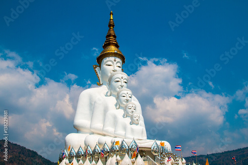 Phetchabun, Thailand - February 23.2017: Buddha statues and colored foot path colorful glass stacked in Wat Pha Kaew, Khao Kho, Phetchabun at Thailand.