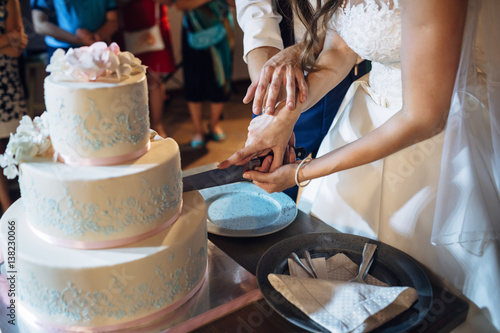 Wallpaper Mural The charming brides cutting a wedding cake Torontodigital.ca