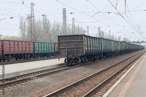 Freight wagons are standing in line at the railway station. Industry