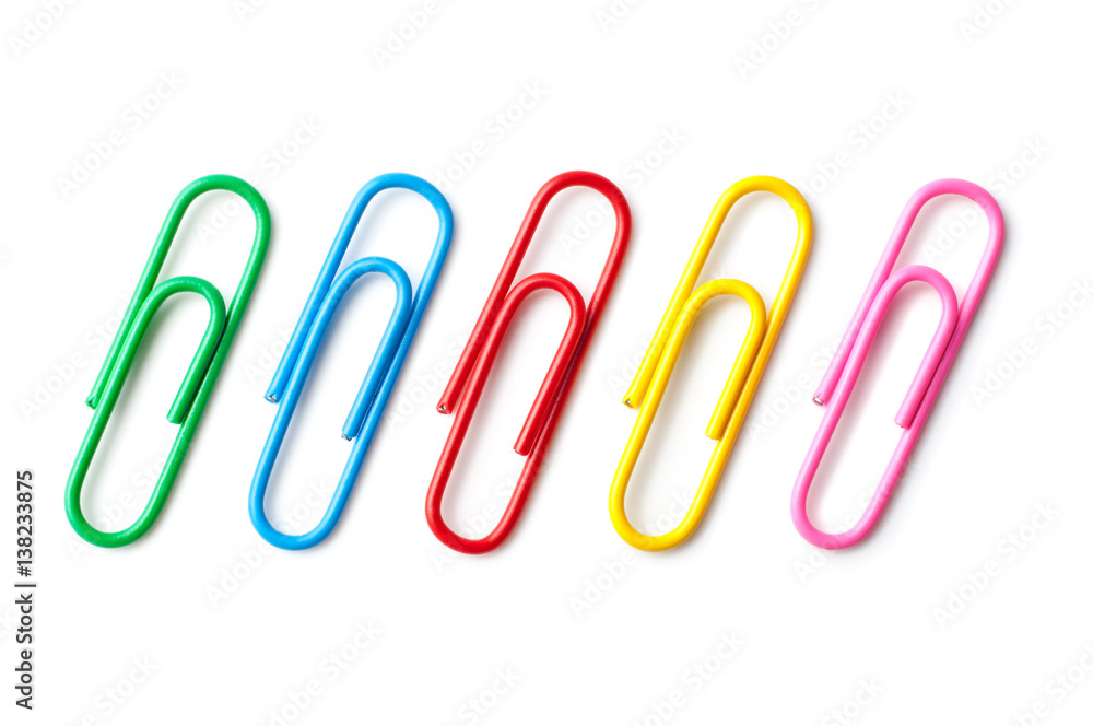 Colored paper clips macro close up isolated on a white background Colored paper clips macro close up isolated on a white background