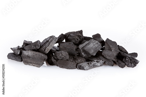 Pile of charcoal isolated on white