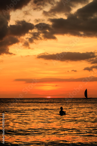 Fototapeta Naklejka Na Ścianę i Meble -  Sailing boats at sunset on a tropical ocean