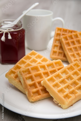 Waffles with berry jam and tea