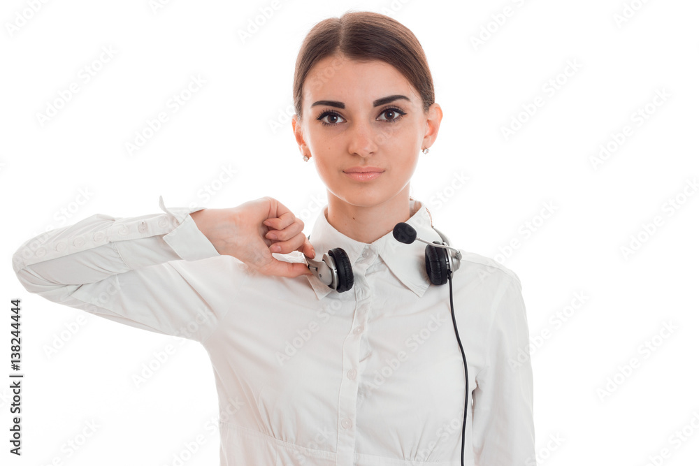 attractive brunette woman working in call center with headphones and microphone and looking at the camera isolated on white background attractive brunette woman working in call center with headphones and microphone and looking at the camera isolated on white background