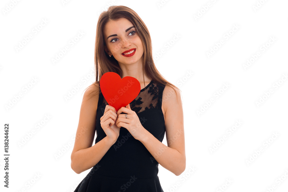 happy brunette woman in love posing with red heart in her hands isolated on white background happy brunette woman in love posing with red heart in her hands isolated on white background
