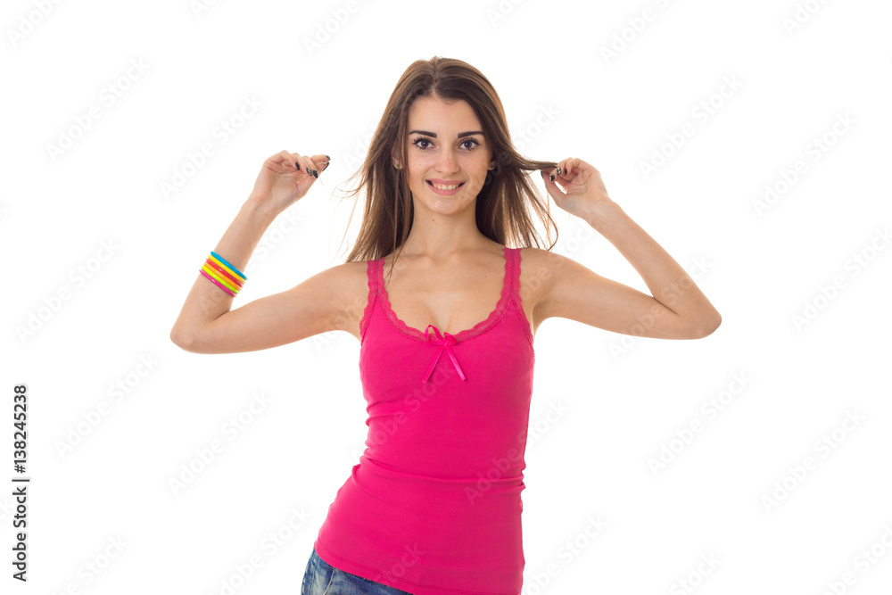 Happy young brunette woman in pink shirt with big natural breasts smiling on camera isolated on white background Happy young brunette woman in pink shirt with big natural breasts smiling on camera isolated on white background