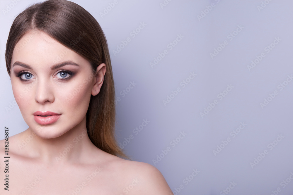 Fashionable portrait of a girl model. Natural makeup,nude shoulders, clean skin.Cosmetic concept . Fashionable portrait of a girl model. Natural makeup,nude shoulders, clean skin.Cosmetic concept .