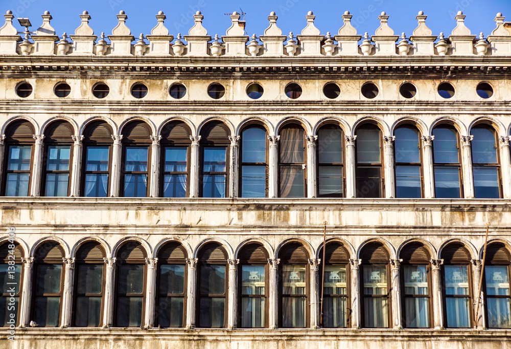 front view closeup of white Doge's Palace white tracery facade in Venice, Italy, Europe