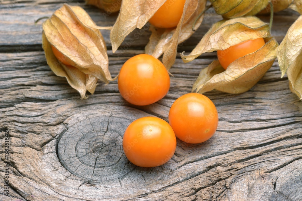 physalis on wooden old table physalis on wooden old table