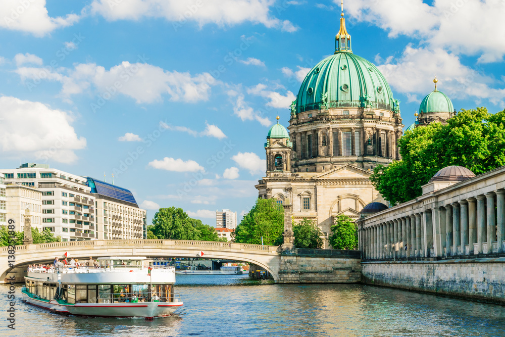 Berlin Cathedral at famous Museum Island with excursion boat river