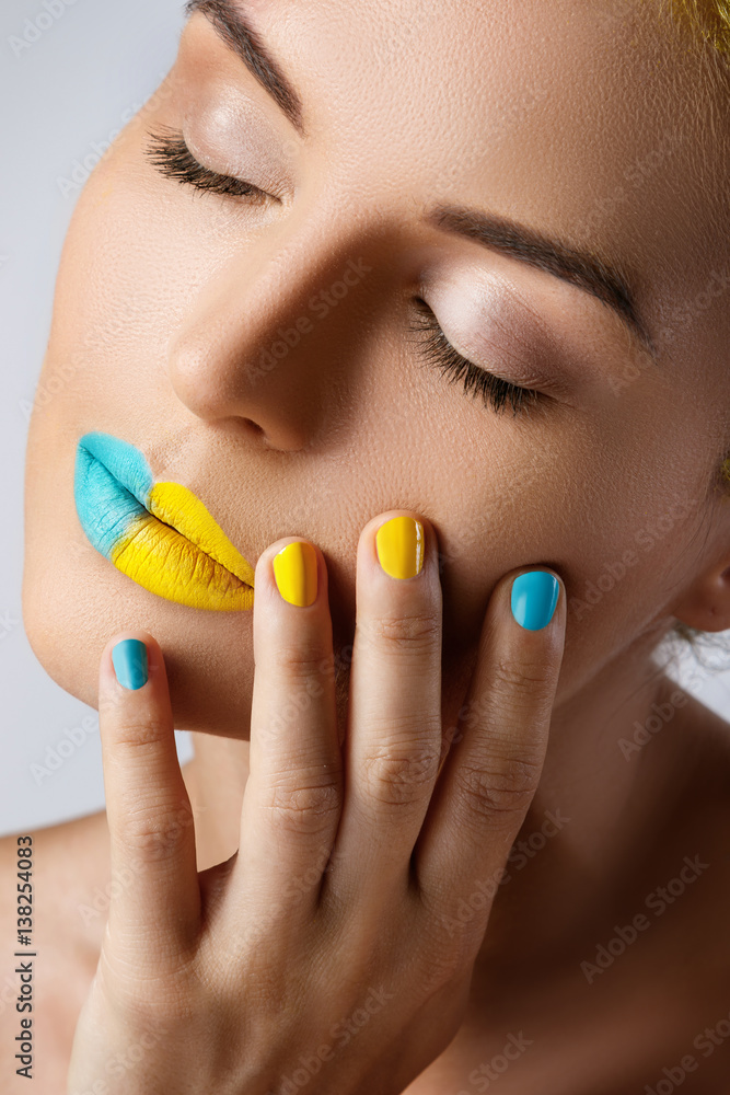 Beautiful woman with colorful nails and lips Beautiful woman with colorful nails and lips