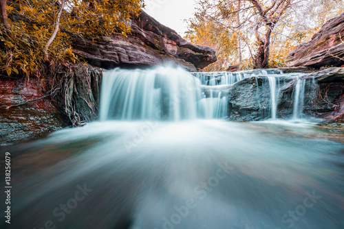 fantasy of beautiful small waterfall and plants of Sang Chan Waterfall in Ubon Ratchathani, Thailand