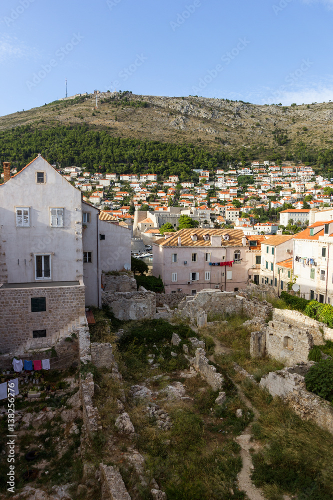 View of ruins and residential buildings at the Old Town and Mount Srd in Dubrovnik, Croatia.