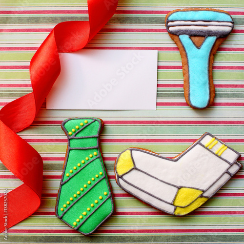 ginger cookies in the shape of clothing with white card photo