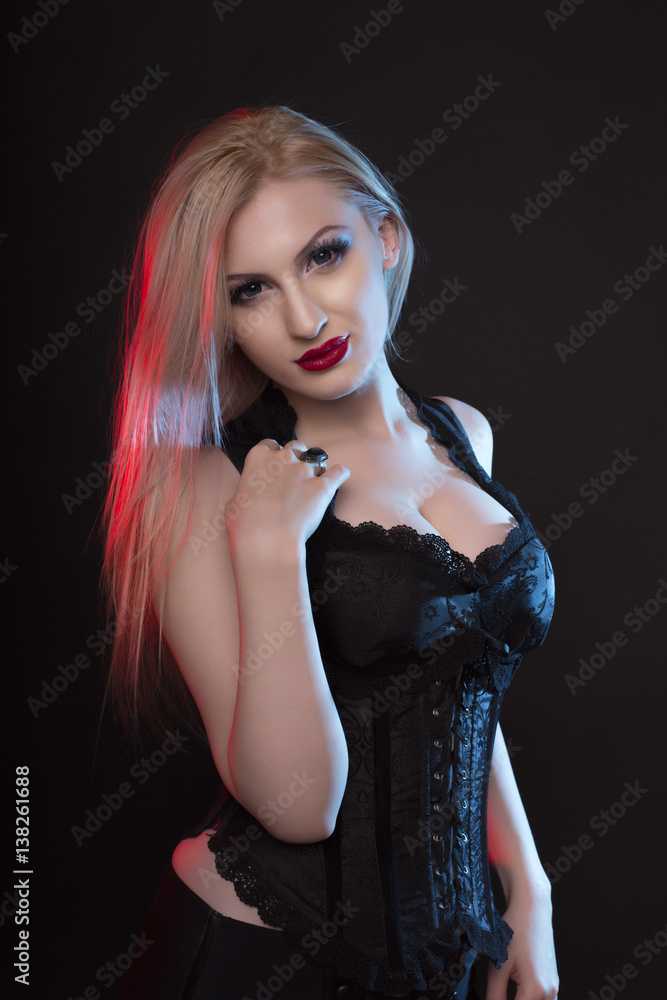 Glamorous woman in a corset with bright evening makeup Glamorous woman in a corset with bright evening makeup