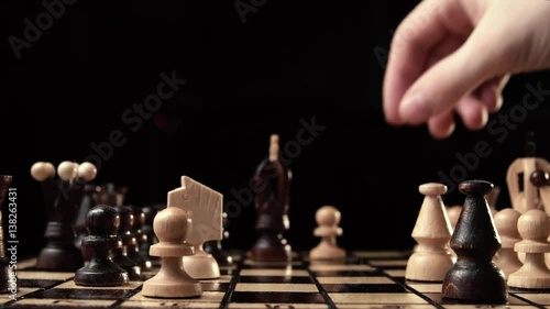 chess closeup, wooden chess board, business concept, black background. slide camera. Studio.