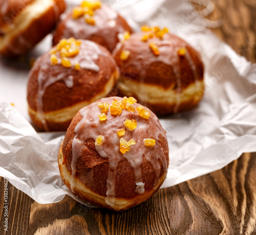 Polish donuts with icing sugar and orange zest