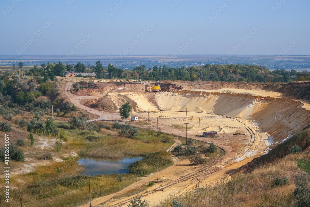 Sand quarry near the town of Orikhiv in Zaporizhzhia region of Ukraine. Excavator  electric power shovel , with bucket capacity of five cubic meters. September 2006