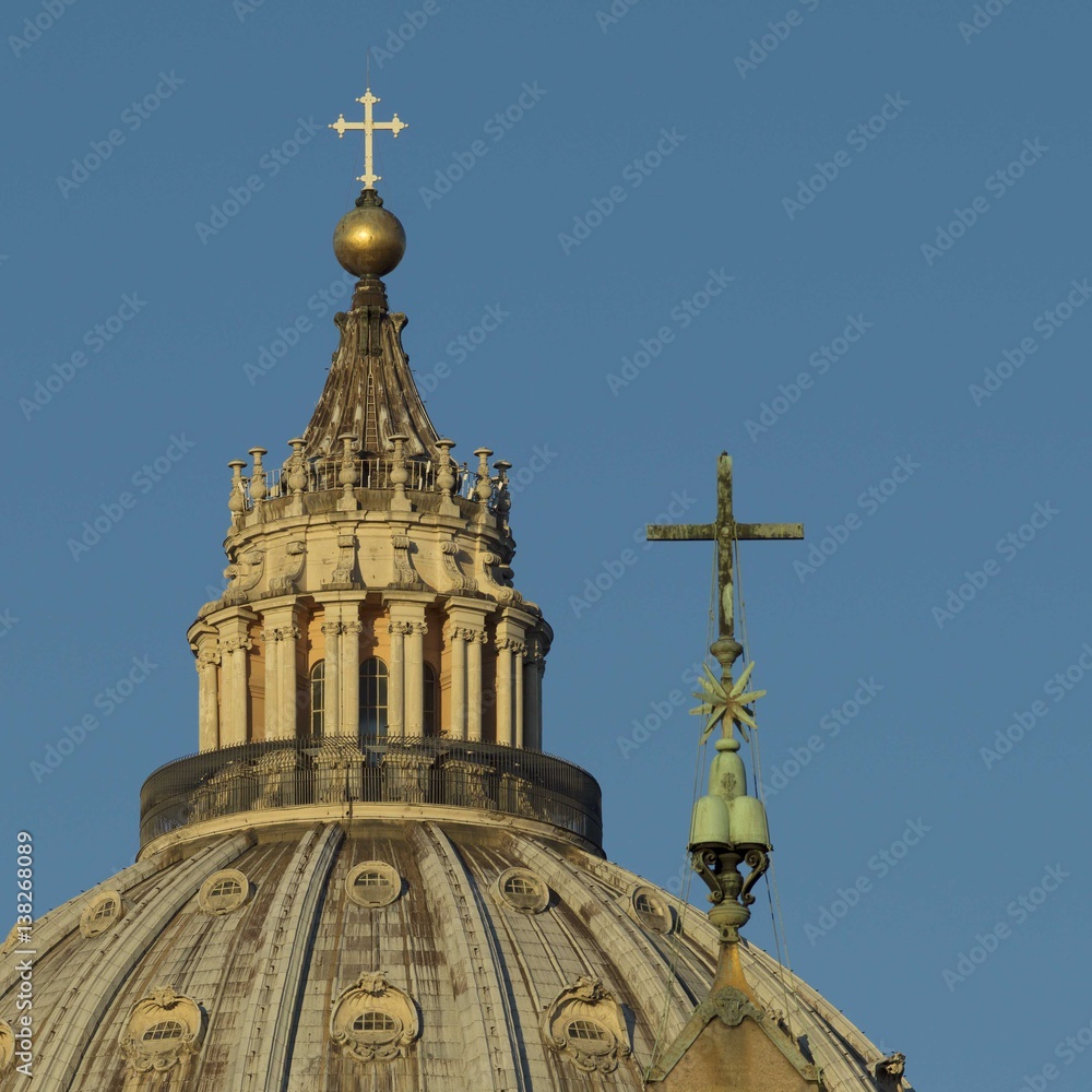 Dome of St Peter's, Vatican, at dawn, juxtaposed with cross on obelisk