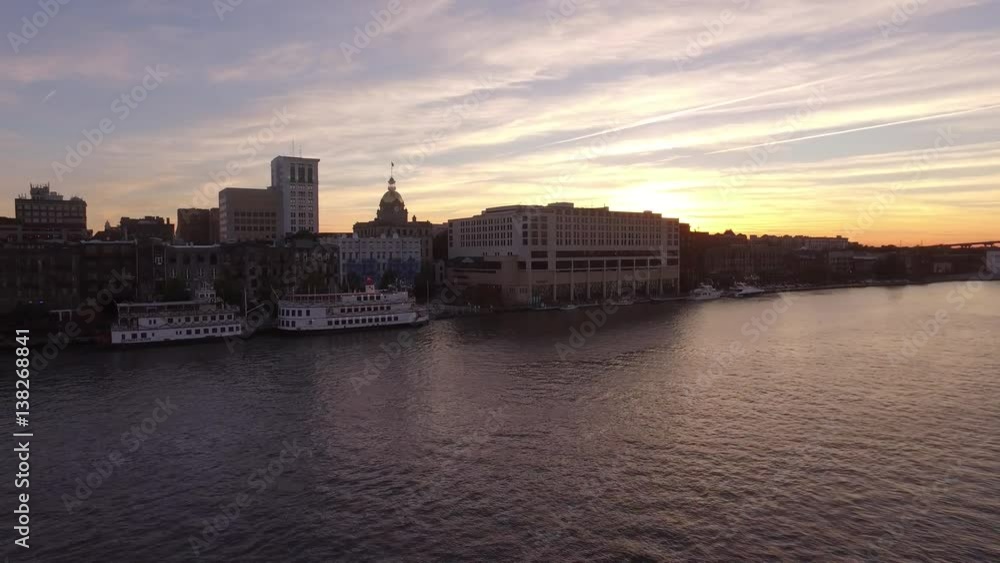 Aerial Shot of Savannah Riverfront Moving Away from Suspension Bridge at Sunset Aerial Shot of Savannah Riverfront Moving Away from Suspension Bridge at Sunset