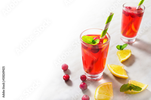 Cranberry lemonade decorated with mint with half isolated background