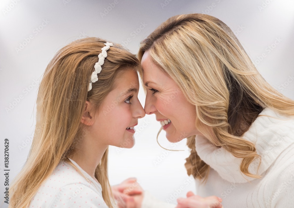 Mother and Daughter against a white background Mother and Daughter against a white background