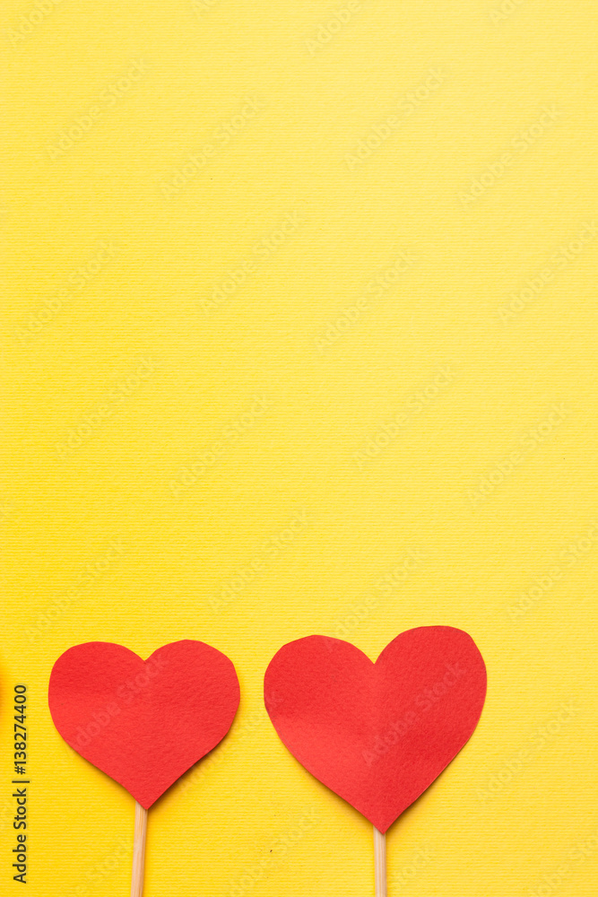 paper hearts on a yellow background