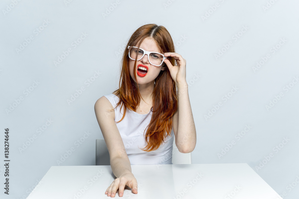 Discontent, emotional woman at the table Discontent, emotional woman at the table