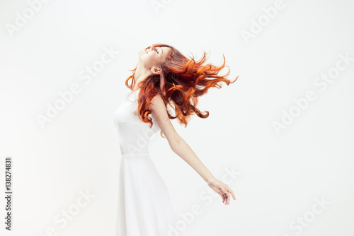 red-haired woman in white dress
