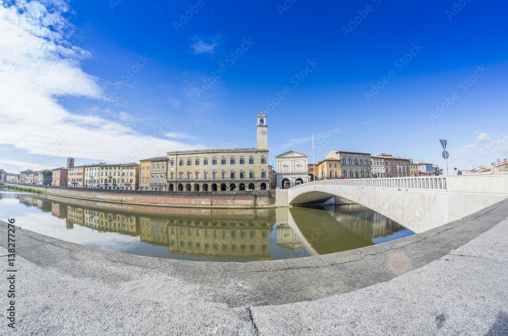 PISA, ITALY - MARCH 2014: Lungarni on a beautiful day. Pisa attracts 3 million tourists annually