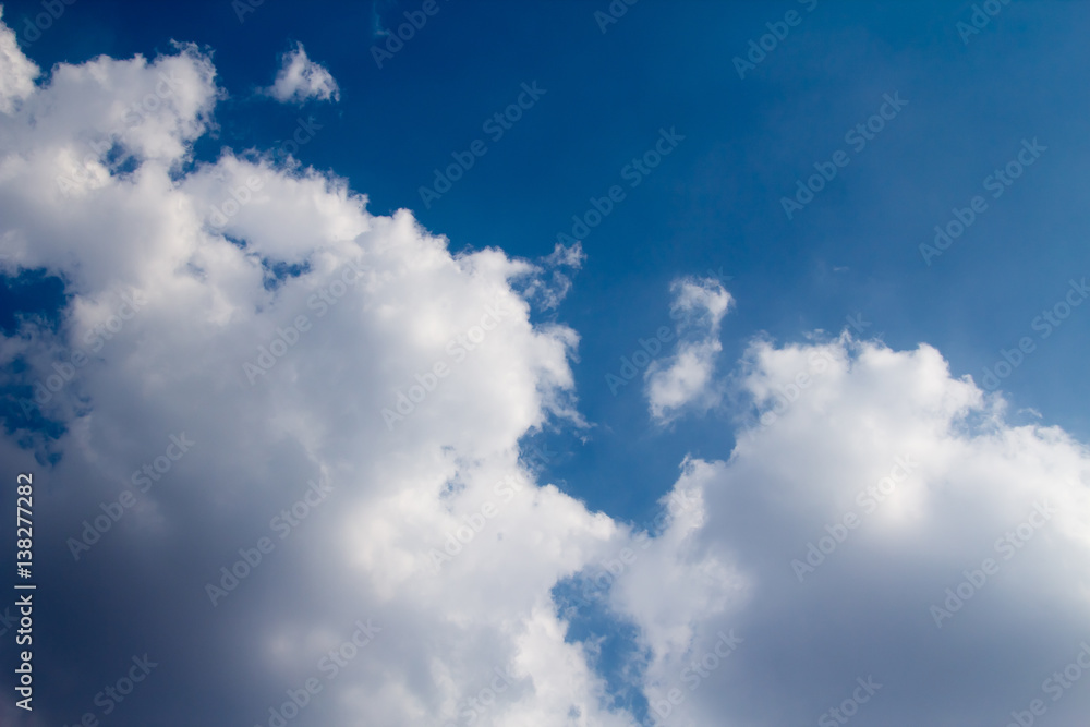 sun with sunbeams in a beautiful cloudy sky. blue sky is covered by white clouds sun with sunbeams in a beautiful cloudy sky. blue sky is covered by white clouds