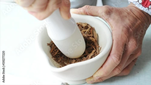 Close-up of person using mortar and pestle to grind ingredients