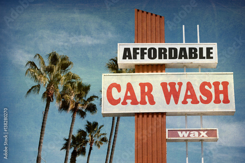 aged and worn vintage photo of car wash sign