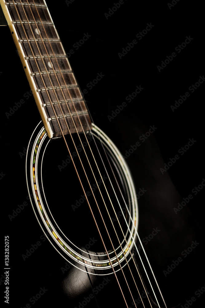 Naklejka premium Six string guitar against a dark backgro