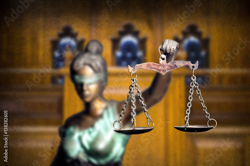 Lady justice or Themis isolated on bench background