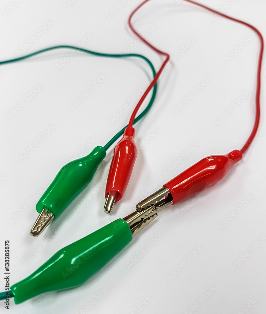Red and green copper clamps for battery charging Red and green copper clamps for battery charging